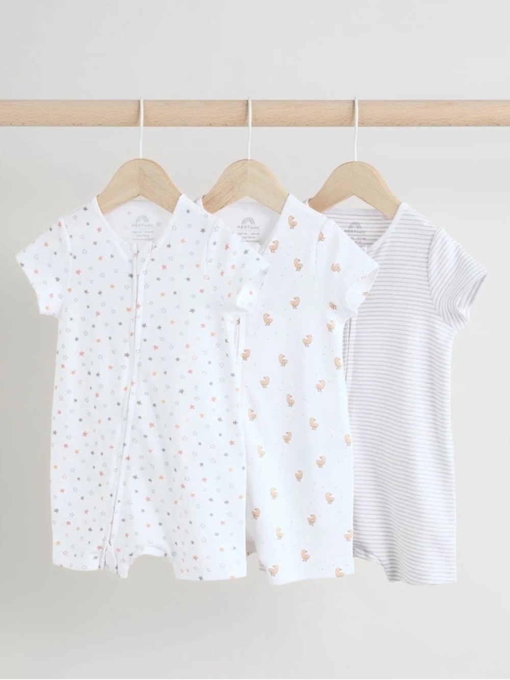 A set of 3 shortie rompers